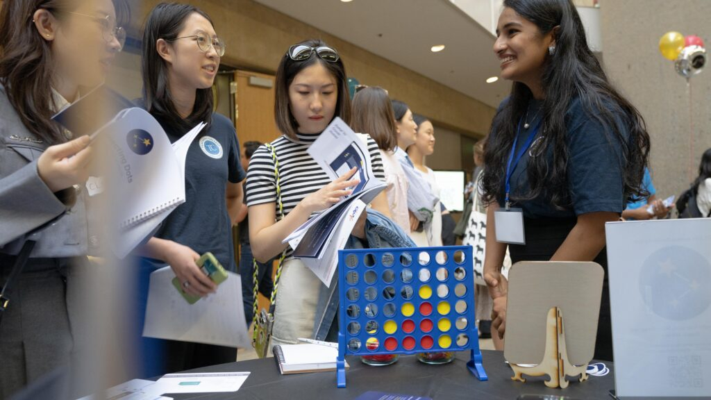 Stanford master's students in the Learning Design and Technology program present their projects at the annual LDT expo. (Photo: Joleen Richards)