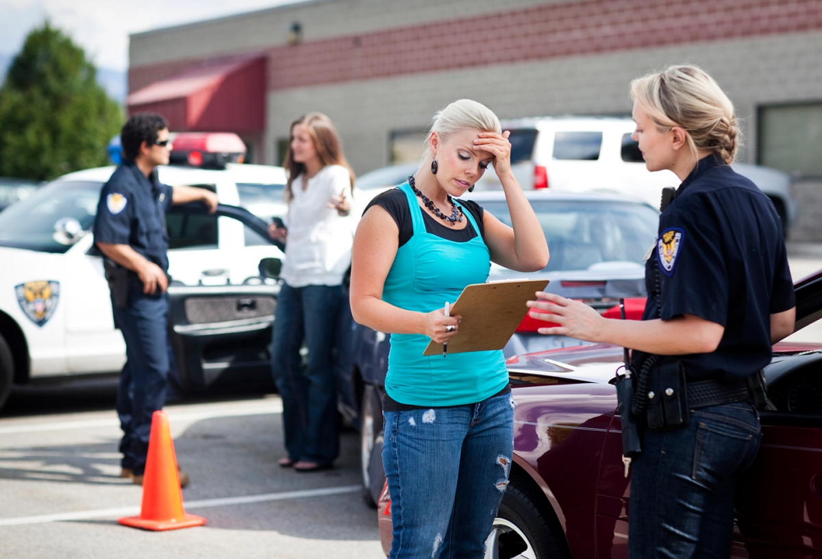 Getty Image of woman talking to police officer
