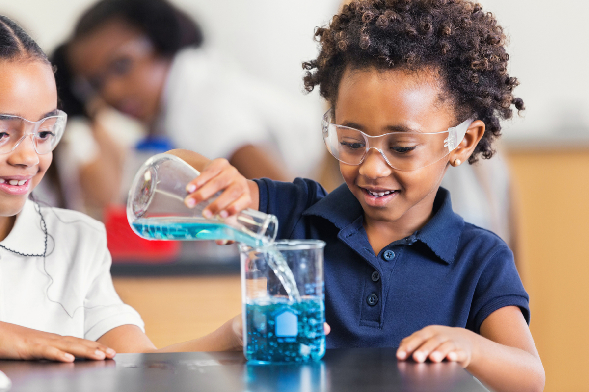 Photo of students of color doing science experiments