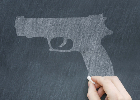 Illustration of a gun being drawn on a chalkboard