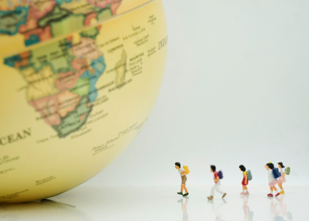 Image of schoolchildren approaching a globe