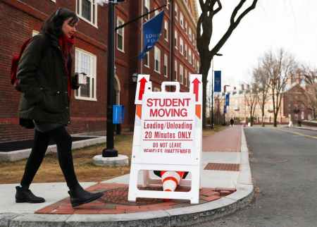 Student walking on Harvard campus