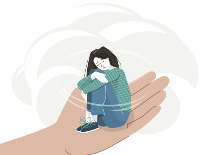 An illustration of a sorrowful young person in the palm of a hand