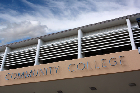 a building with a sign reading "community college"