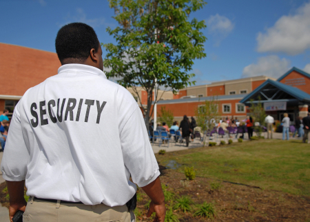 a security guard outside of a school