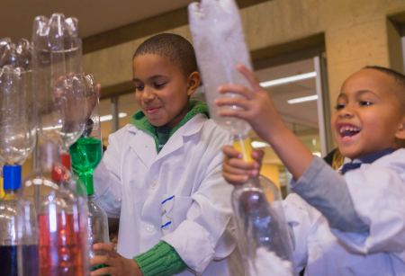 Photo of Lance and Miles Clunie witnessing a cyclone in a bottle.