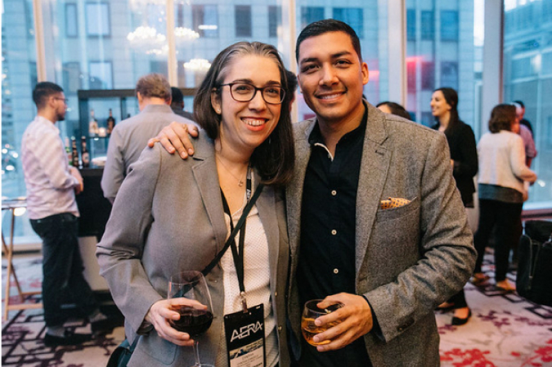 Photo of two people at an alumni event