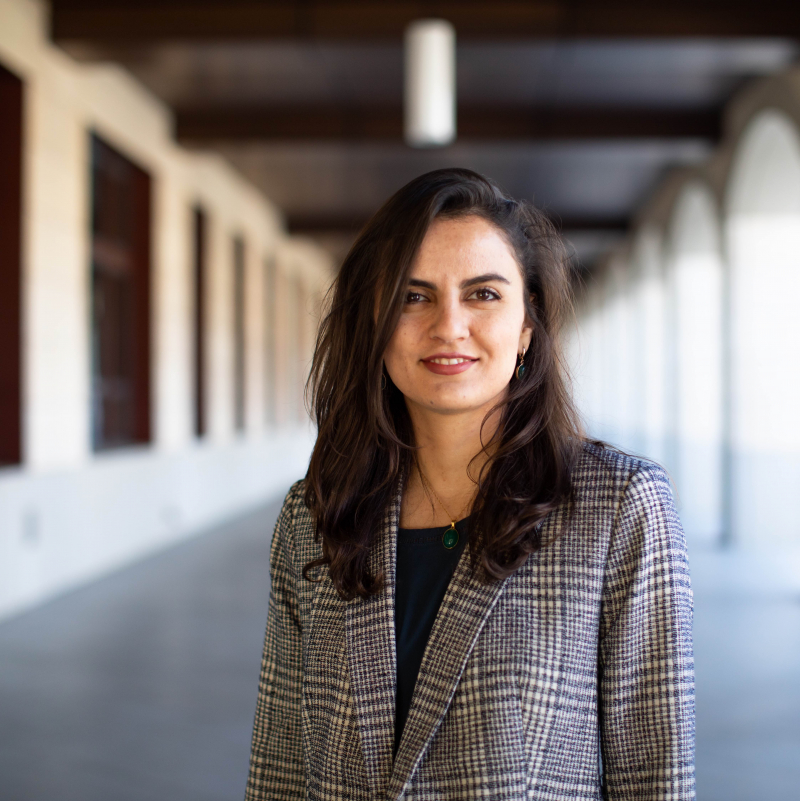 Faculty member Shima Salehi, photographed standing in a Stanford arcade