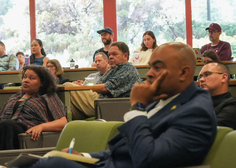 Participants (including Professor Bryan A. Brown, in foreground, and Professor Emeritus John Baugh, center background) look on and listen during the third annual Ball Lecture
