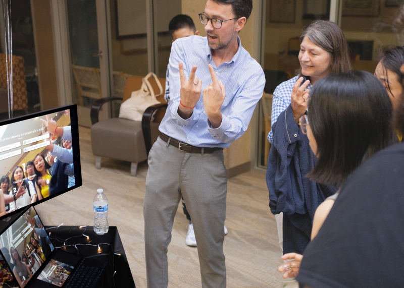 LDT student Brent Johnson shows guests how to interact with his project Quizeo.ai.