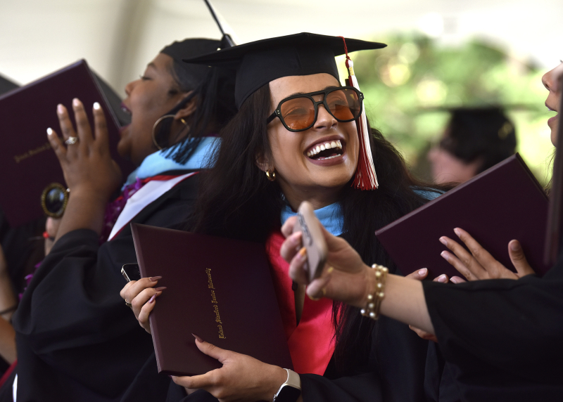 GSE students cheer as fellow graduates receive their diplomas on Sunday, June 16. (Photo: Charles Russo)
