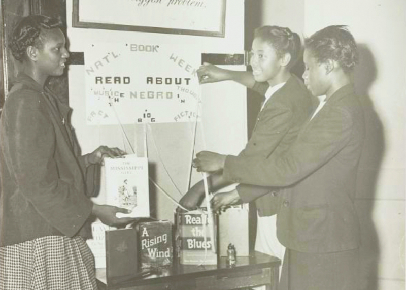 Photo of girls making a display for National Book Week