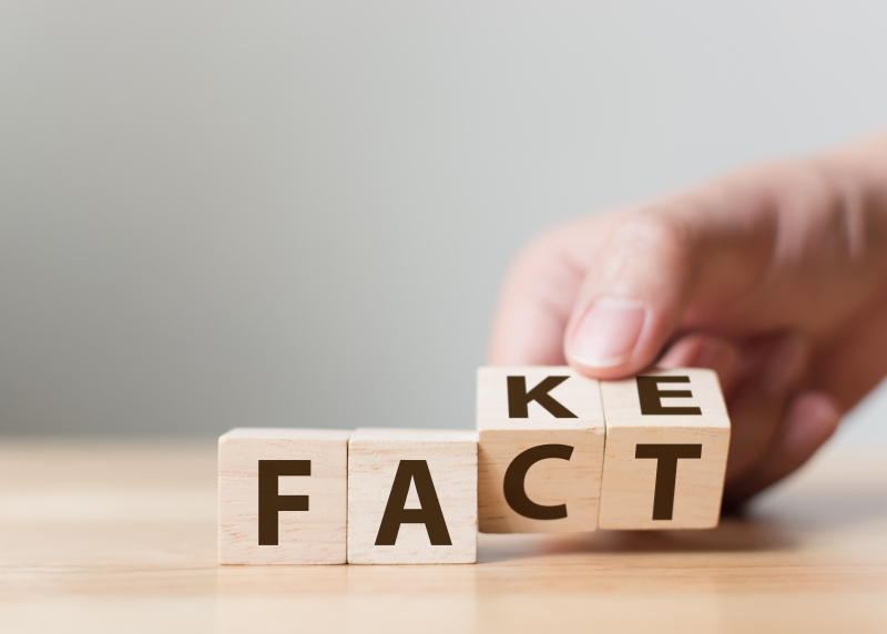 Photo of wooden block letters spelling, alternatively, "Fact" or "Fake"