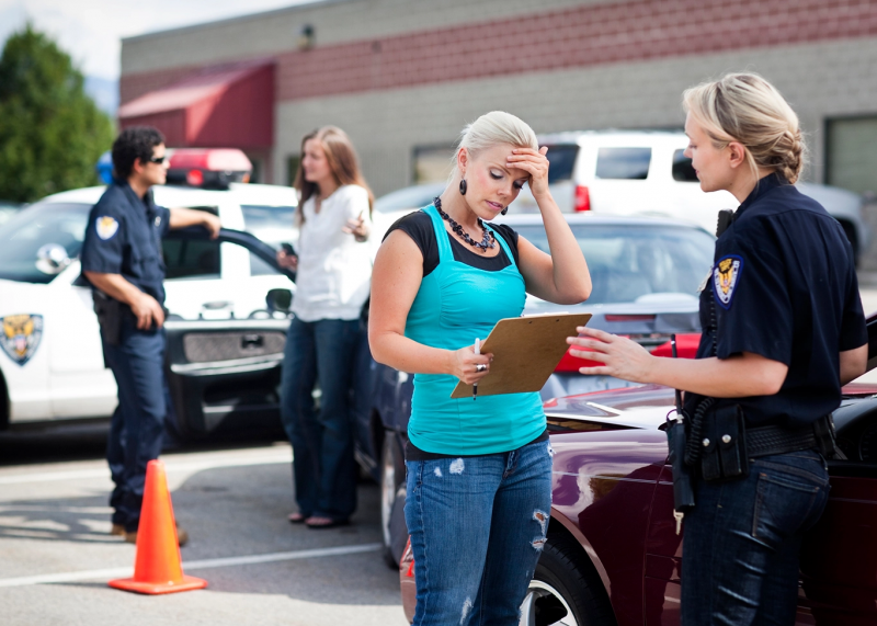Getty Image of woman talking to police officer