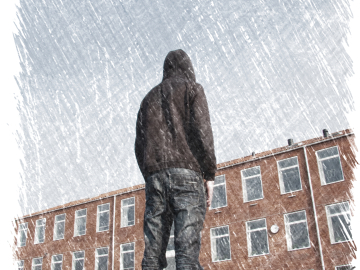 Image of young man outside of a school