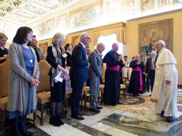 Photo of the pope greeting researchers