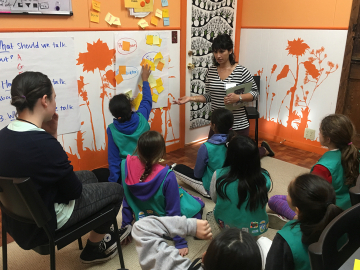 Photo of Girl Scouts preparing to survey community members for an environmental project