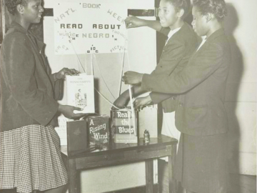 Photo of girls making a display for National Book Week