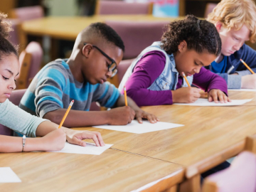 Students in a classroom taking a test