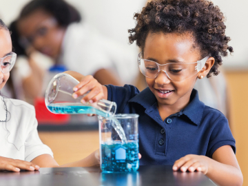Photo of students of color doing science experiments