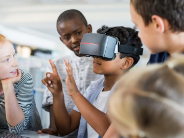 Photo of students using virtual reality headset in the classroom