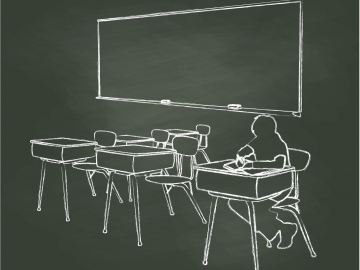 Photo of child in classroom with empty desks