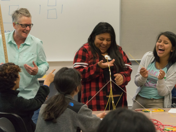 Cathy Williams, left, works with students during a Youcubed math workshop for girls at Stanford. (Photo: Marc Franklin)